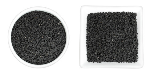 Nigella sativa or Black cumin in ceramic bowl isolated on white background. Top view. Flat lay.