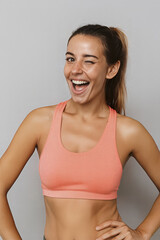She looks confident and energetic after a workout. This portrait promotes a healthy active lifestyle fitness and positive body image.