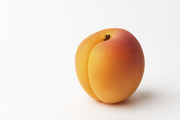 The smooth orange and red fruit is shown whole and uncut. This simple image highlights the natural beauty and simplicity of the healthy food.