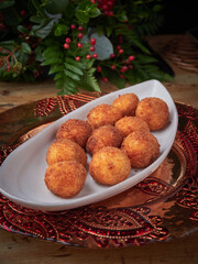 Fried croquettes balls serving on festive platter