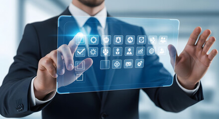 Businessman interacting with futuristic holographic interface displaying digital icons and data
