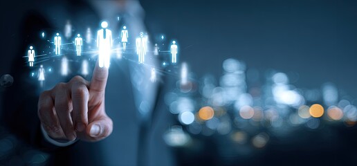 A person's finger points at illuminated figures, representing networking or connection, over a blurred cityscape