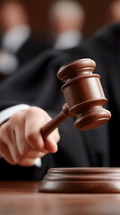 Judge striking gavel in courtroom during proceedings  