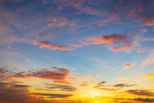 Fototapeta Awesome sunset and soft pink clouds of pastel tones. Image template of textured sky. Gorgeous photo wallpaper. Bright epic sky. Dramatic evening light and fiery orange sunset. Beauty of earth.