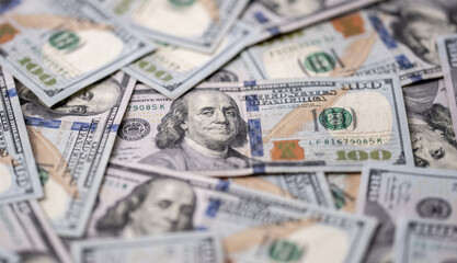 Money background with 100-dollar bills. Texture of US currency. 100 USD banknotes background. American hundred-dollar notes background. Pattern of US dollars for finance concept. USA many background.