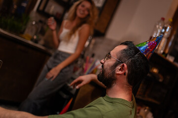 Friends Celebrating at a Home Party in a Relaxed Atmosphere