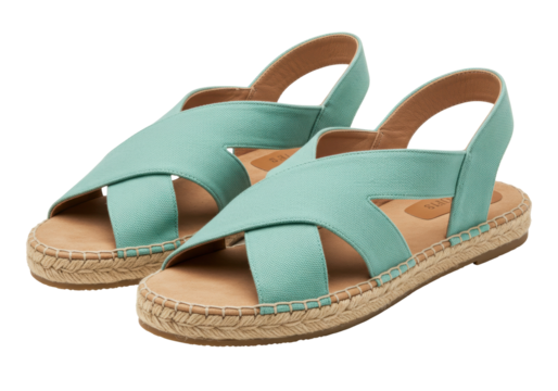 Isolated pair of espadrille sandals, light turquoise, straw, casual footwear fashion