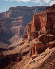 Vast canyon with layered rock formations in the desert landscape.