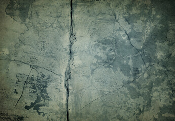 Damaged grunge pastel colored cracked wall background.