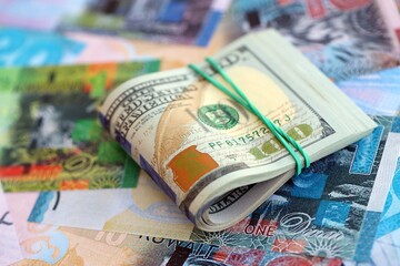Kuwaiti dinar currency money bills and bunch of us dollar banknotes. Concept of currency exchange