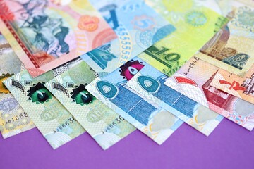 Bahraini dinar money bills in big amount on purple. Finance and banking concept