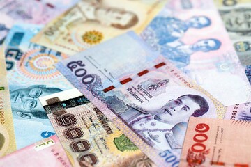 Thai baht currency money. The current banknotes lies on table in big amount