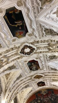 Salamanca University with its historic facade and ornate Plateresque architecture under a bright sky in Salamanca, Spain