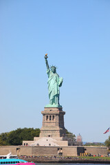 Obraz premium Statue of Liberty one of the most iconic symbols of New York city under a blue sky