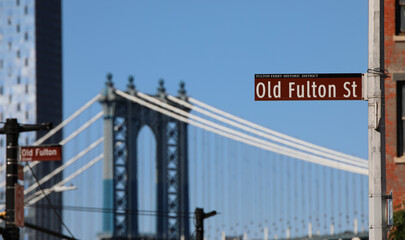 Road Signal in OLD Futon Street and blue tower of Manhattan Bridge in NYC
