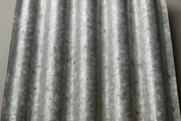 Fototapeta premium Corrugated Metal Sheet Close Up: A detailed close-up shot of corrugated metal sheet shows the texture and industrial aesthetic.