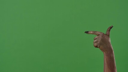 A creepy zombie hand points to the side