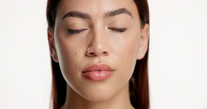 Face, woman and serious with skincare in studio for beauty, laminated eyebrows and natural glow. Portrait, person and cosmetics for facial shine of dermatology, treatment results and white background