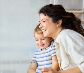 mother and daughter playing and having fun at home