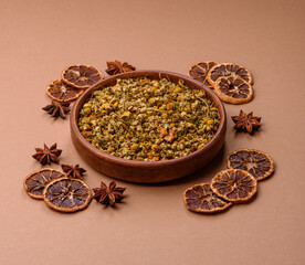 Dried chamomile flowers, herbal tea in a bowl for a hot morning drink. Dried chamomile