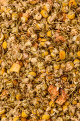 Dried chamomile flowers, herbal tea in a bowl for a hot morning drink. Dried chamomile