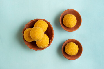 Besan Laddu, a classic Indian sweet, is made from roasted gram flour, ghee, and sugar, flavored with cardamom and dry fruits. Popular during festivals, it’s a rich, aromatic, and melt-in-mouth delicac