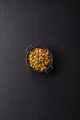 Dried chamomile flowers, herbal tea in a bowl for a hot morning drink. Dried chamomile