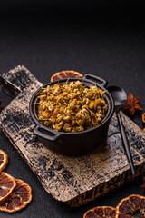 Dried chamomile flowers, herbal tea in a bowl for a hot morning drink. Dried chamomile