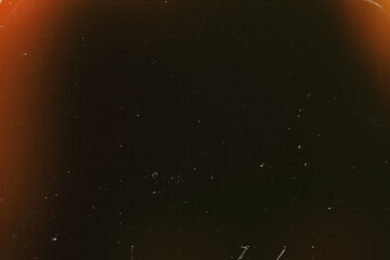 Light overlay, orange warm color. Blurry spots. Old film light leak texture with scratches, grain, noise and dust. Perfect as background or overlay for photo editing, video design, and digital art.