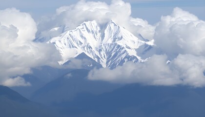 A majestic snow-capped mountain peak emerges from a sea of fluffy white clouds, set against a deep blue sky.