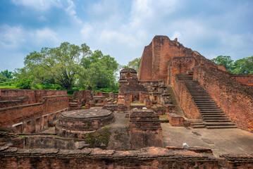 Fototapeta premium The ruins of Nalanda University in Bihar are a UNESCO World Heritage Site, once a great center of learning (5th–12th century). Its red-brick monasteries, temples, and libraries reflect India’s ancient