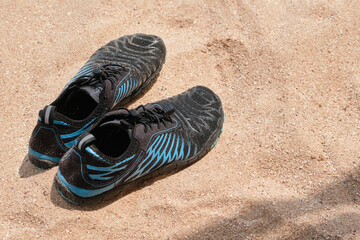  Water shoes, swimming neoprene shoes in a sand. Water shoes for swimming in the sea with corals.