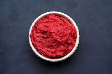 Fresh tomato paste or puree on black background	