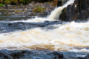 A beautiful Quebec waterfall in the fall colors
