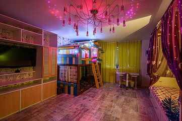 whimsical child's room with a playful bunk bed shaped like a house, bright curtains, and unique lighting