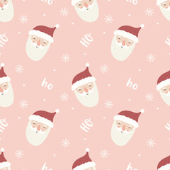 Cute seamless pattern with santa claus faces, snowflakes and ho ho ho lettering on pink background.