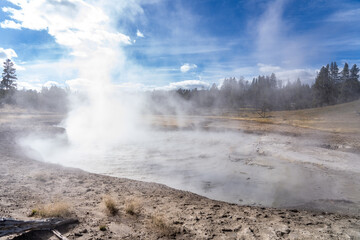Churning Caldron. Mud Volcano area, Yellowstone National Park, Wyoming. A mud volcano or mud dome is a landform created by the eruption of mud or slurries, water and gases