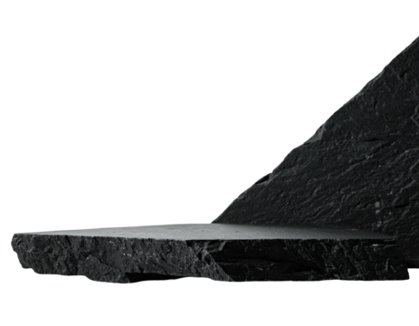 Dark, textured stone platform angled against a black backdrop
