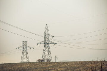 High Voltage Poles or Electric tower is transmission high voltage power locate on green field -...