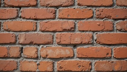 Fototapeta premium Close-up view of a weathered brick wall, showing texture and mortar details.