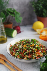 A bowl with traditional Israeli Salad