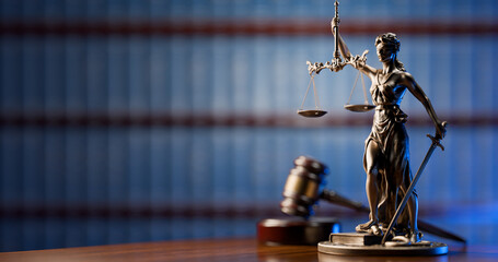 Fototapeta na wymiar Legal Concept: Themis is the goddess of justice and the judge's gavel hammer as a symbol of law and order on the background of books