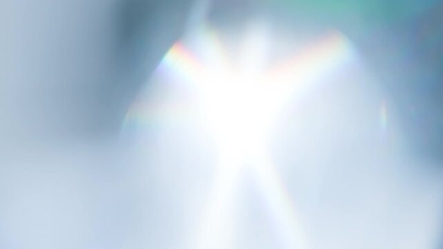 Sunshine in a Thick Prism. Loop. The light passes through the facets of a slowly rotating diamond and creates repetitive sparkling highlights and rainbow colors