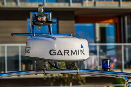 Gothenburg, Sweden - september 29 2024: garmin marine radar on boat with modern architecture in background.