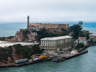 Alcatraz Island in San Francisco Bay features the iconic prison, lighthouse, water tower, rugged...