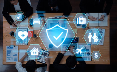 A group of professionals collaborates in a modern office while digital security icons overlay the scene, highlighting the importance of data protection and strategic planning. Trope
