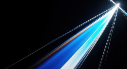 Abstract light streaks and trails of blue and white light on a dark background