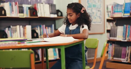 Kid, student and writing for learning in library with workbook, studying and education sheet. Girl, elementary school and book for creative assessment, activity solution and information for knowledge - Powered by Adobe