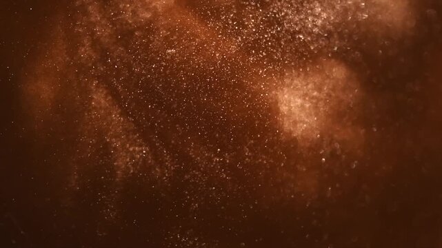 Gold particles floating background, Liquid gold, golden abstract backdrop. Golden dust abstract backdrop. Beautiful metallic yellow texture, swirls. Metallic paint closeup. Art Wallpaper waves surface