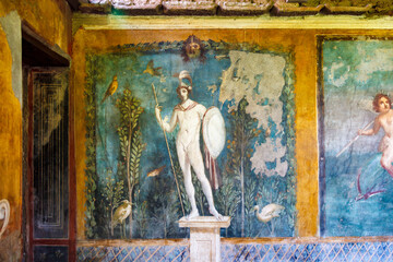 ancient roman art on a Pompeii wall of a warrior with lance and shield